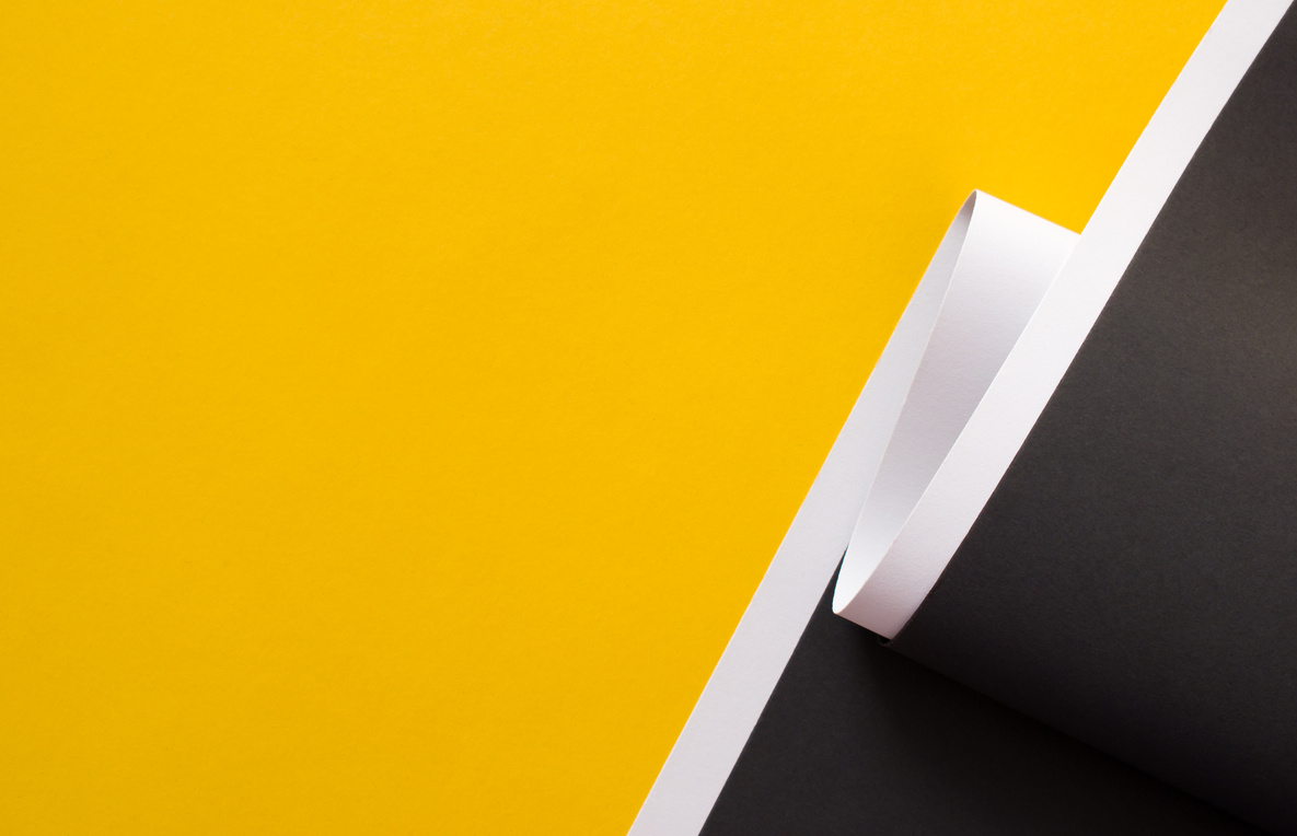 Yellow and black abstract background divided with white stripe